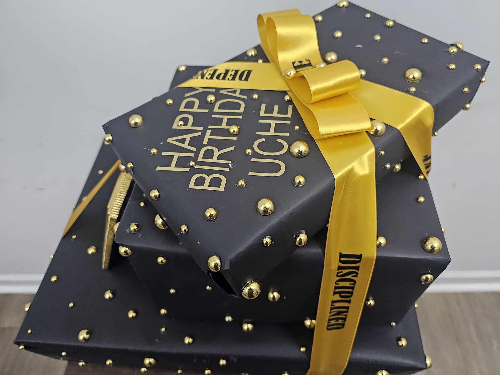 Black and gold birthday ribbon detail