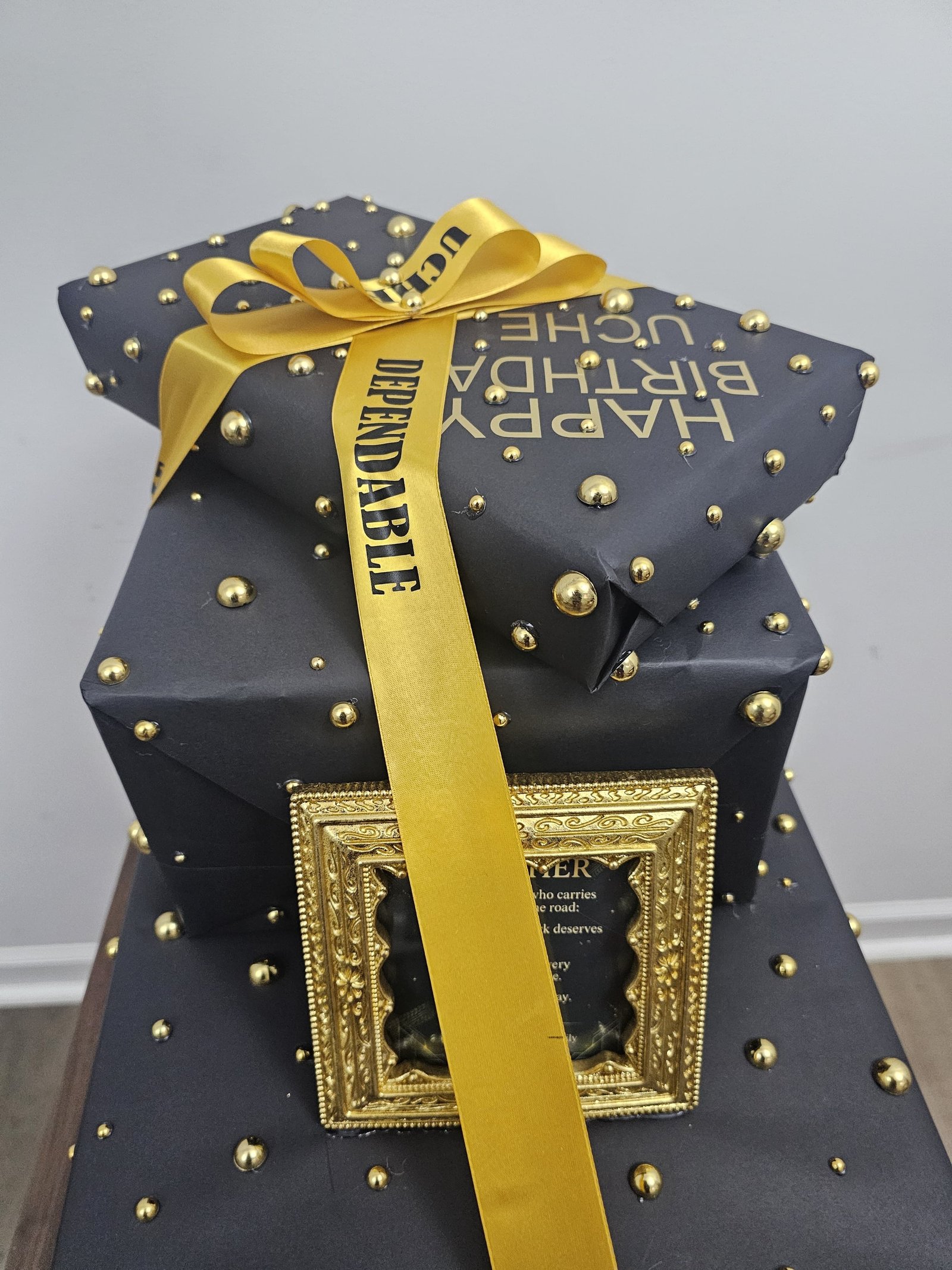 Black and gold gift with framed message