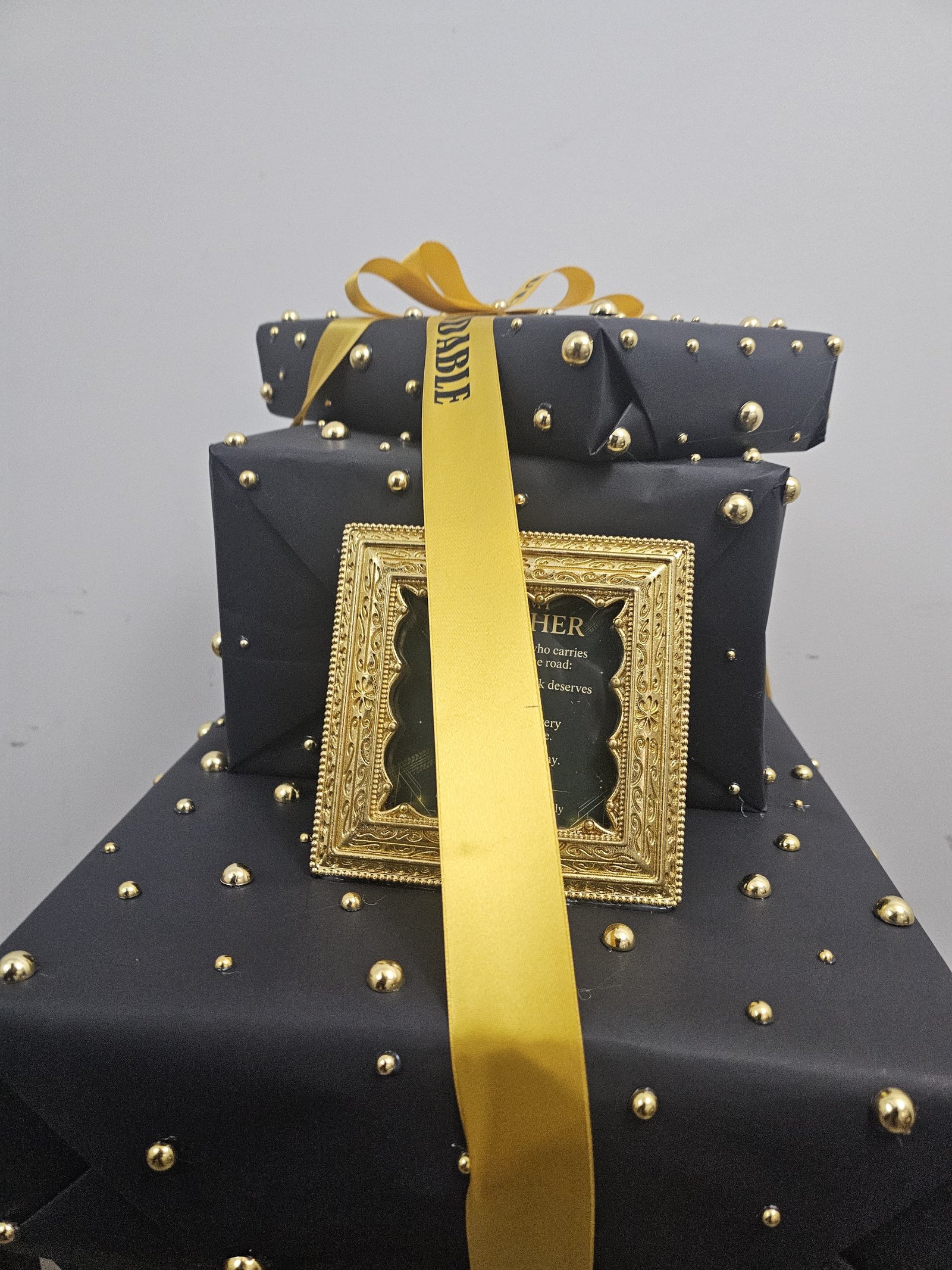 Centered black and gold custom gift stack
