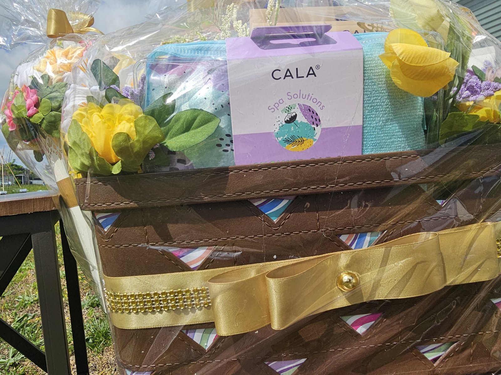 Cala floral gift basket with ribbon detail