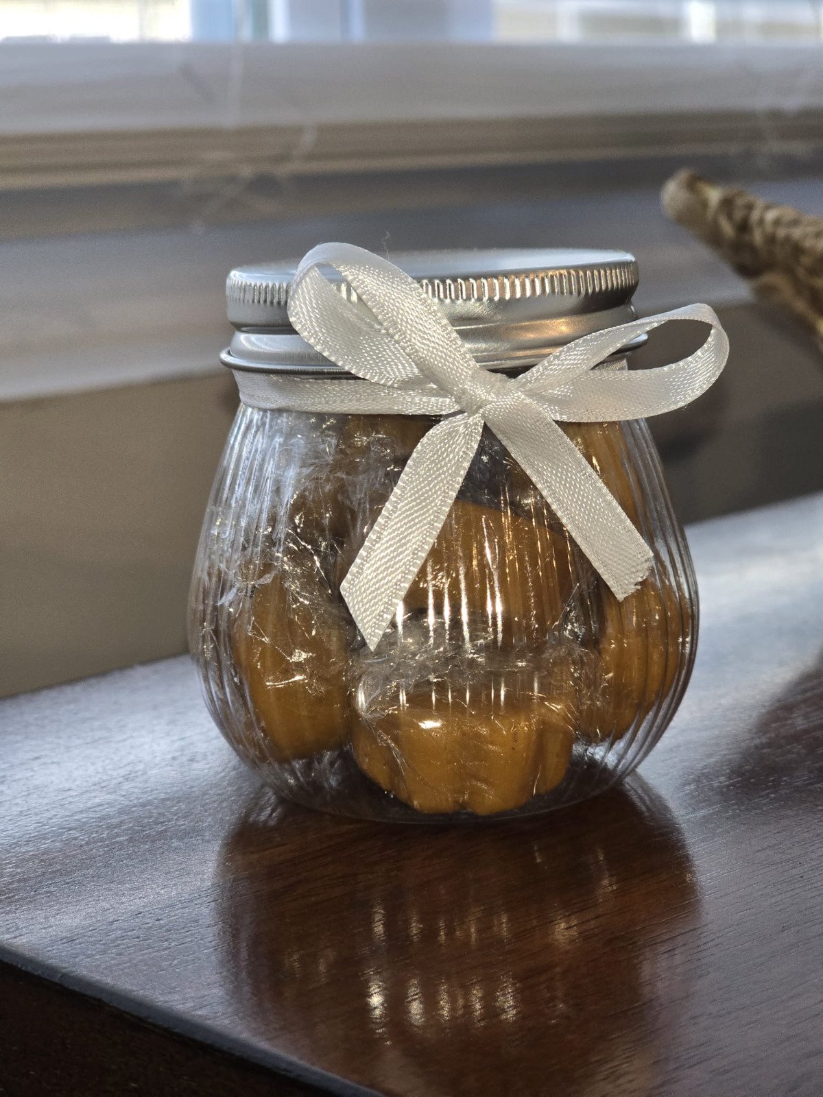 Candy in a glass jar with ribbon