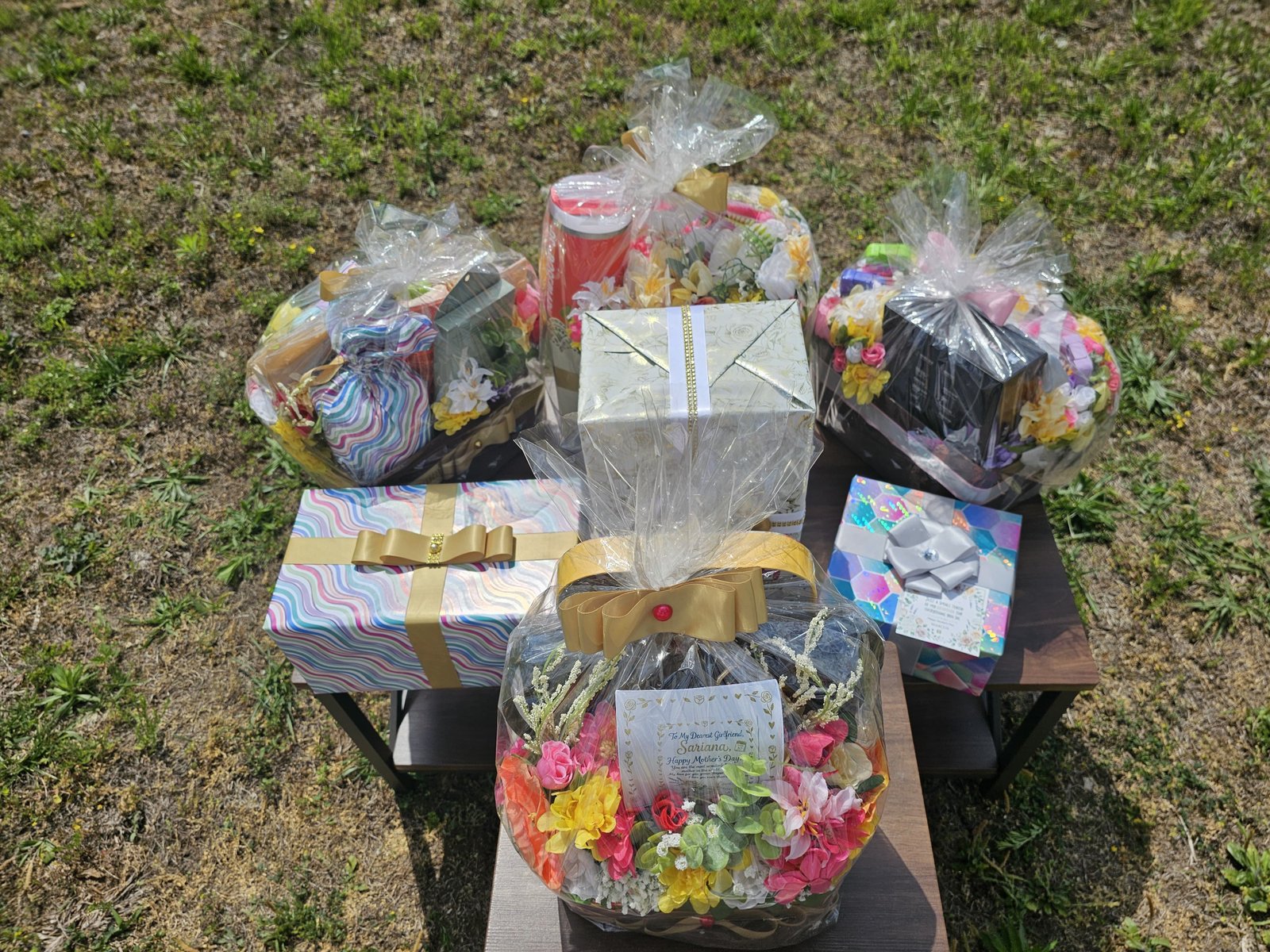 Outdoor gift table with assorted baskets and boxes