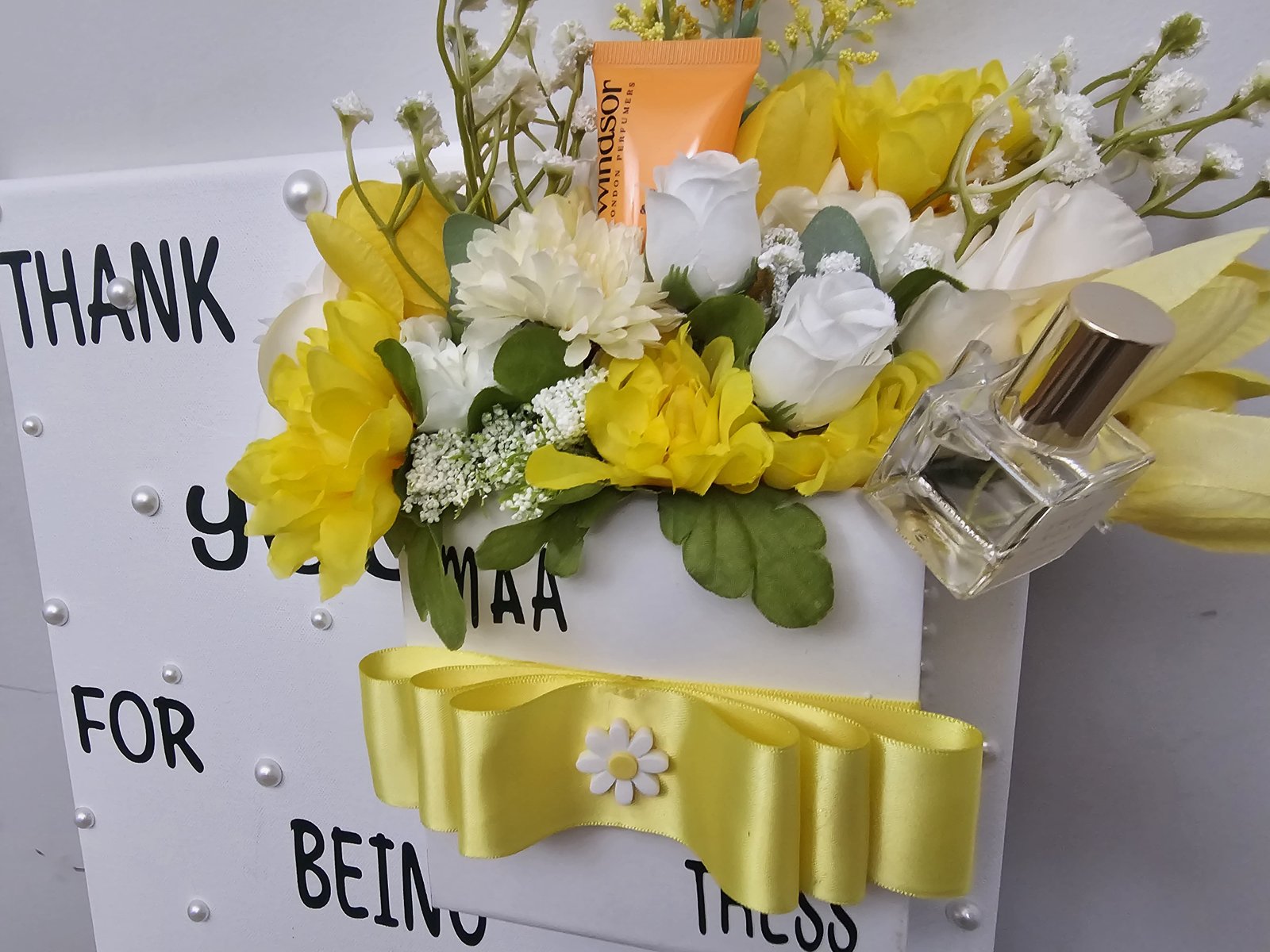 Yellow thank-you board arrangement